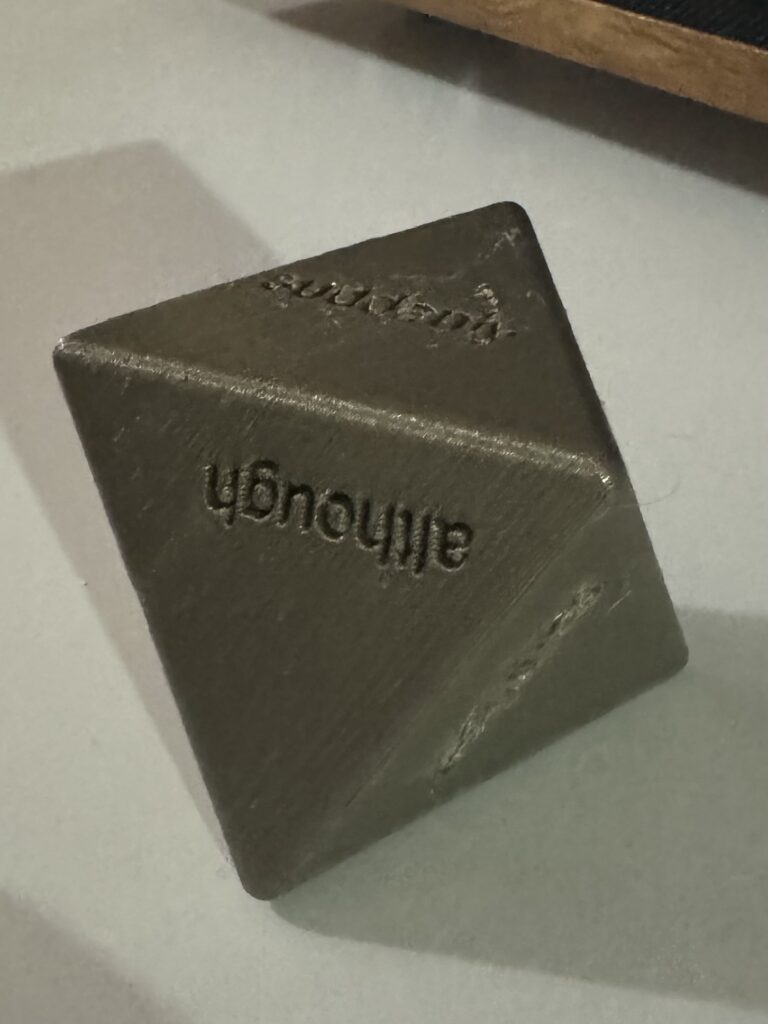 3d printed die with coordinating conjunctions on each side