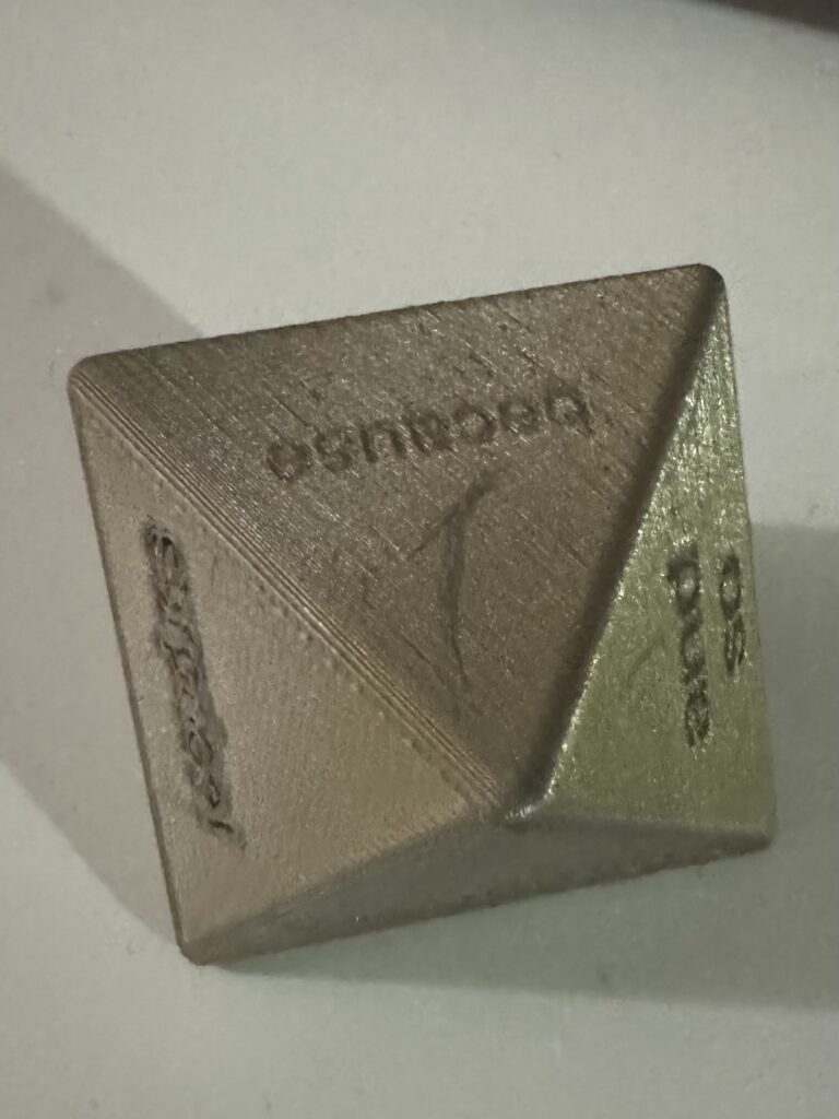 3d printed die with coordinating conjunctions on each side