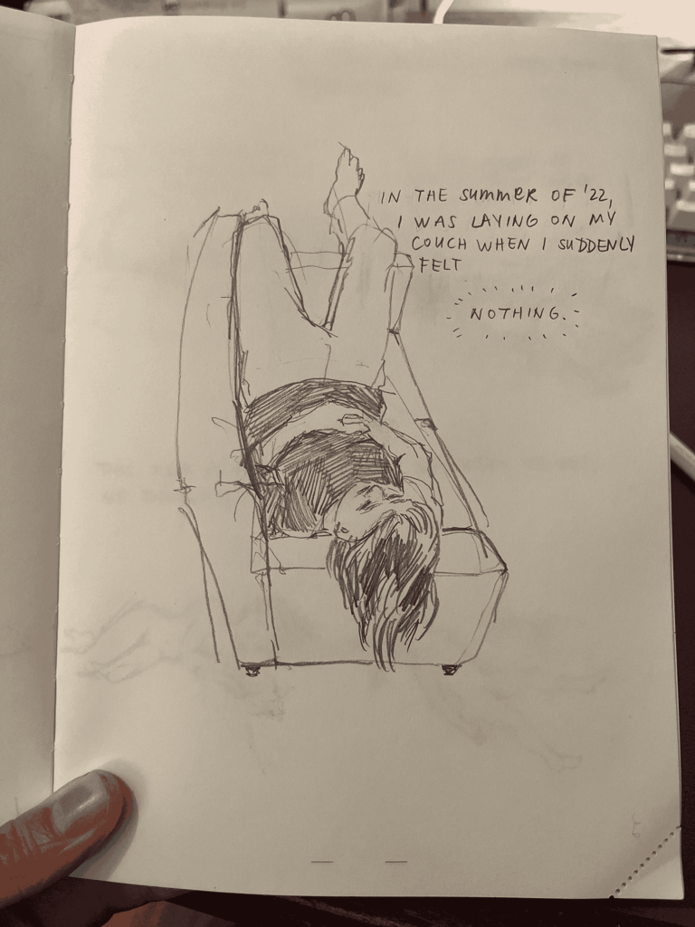 Page 1 of a comic drawn on paper. It shows a person lying on a couch. Text says "In the summer of '22, I was laying on my couch when I suddenly felt nothing".