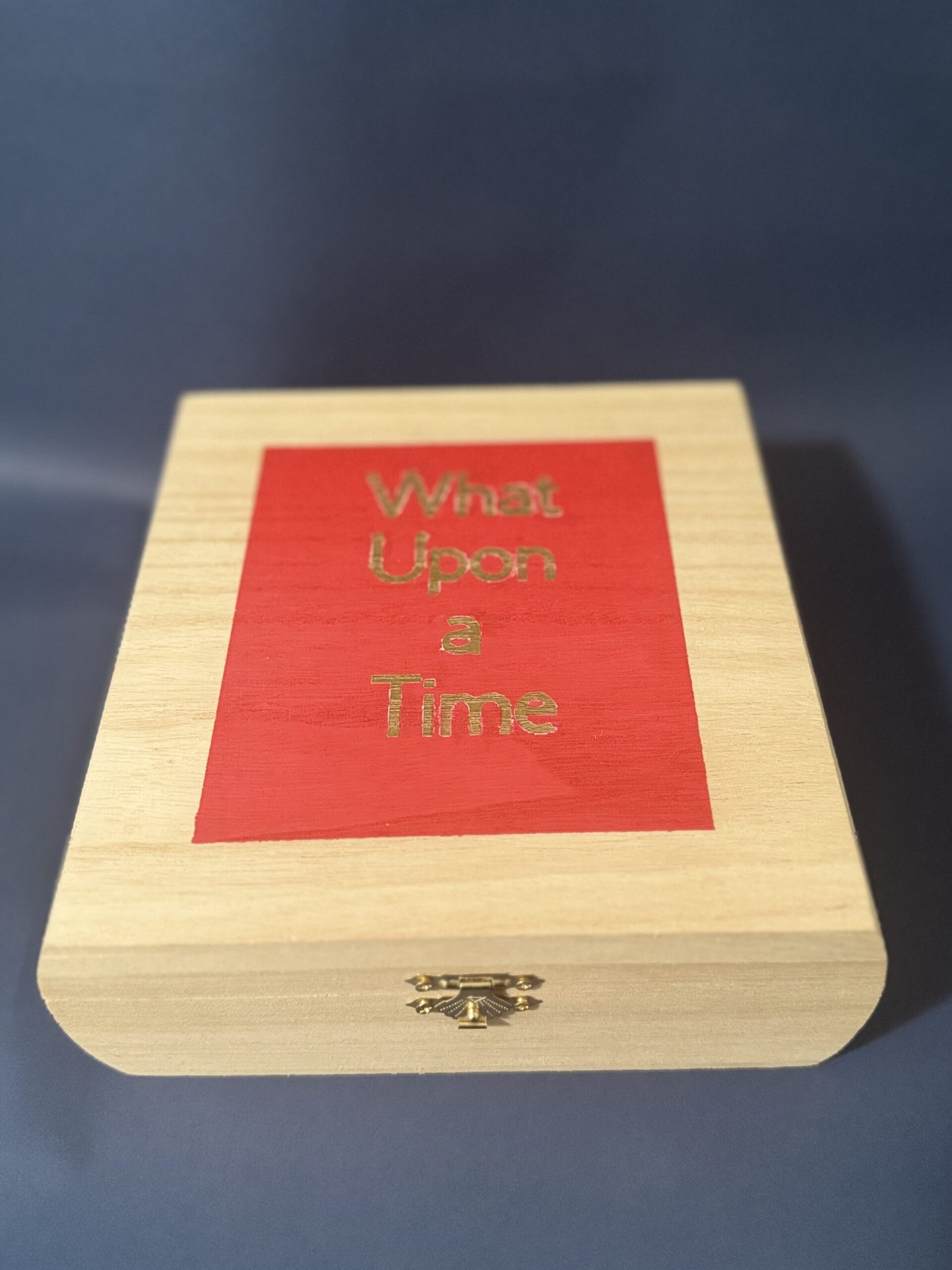 a wooden game box with the title What Upon a Time